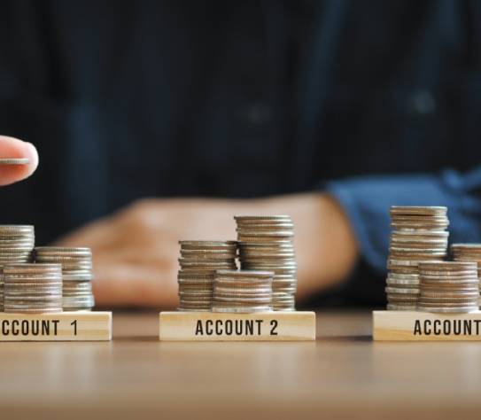 businessman hand stacking coins for finance investment management by